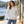 Next Level 9302 Unisex Malibu Hoodie Sweatshirt in Oatmeal — woman at a lakeside boathouse with a paddle propped nearby