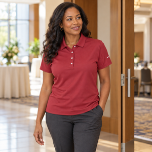 Woman wearing the Nike 203697 polo in Pro Red, realistic lifestyle photo