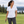 Woman wearing the Nike NKDC1991 polo in White, realistic lifestyle photo