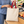 Q-Tees QTB6000 natural cotton tote with red handles being packed at a grocery checkout